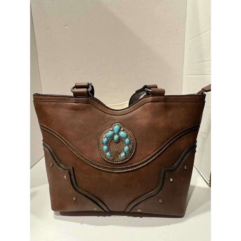 brown faux-leather Justin Naja Concho bag accented with a turquoise